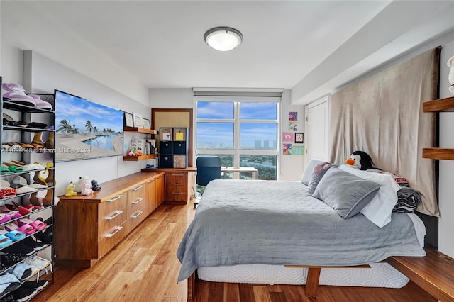 bedroom with light wood-type flooring