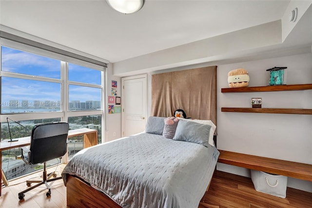 bedroom featuring hardwood / wood-style flooring