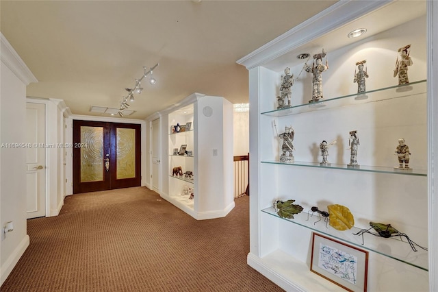 hall featuring french doors, carpet floors, and ornamental molding