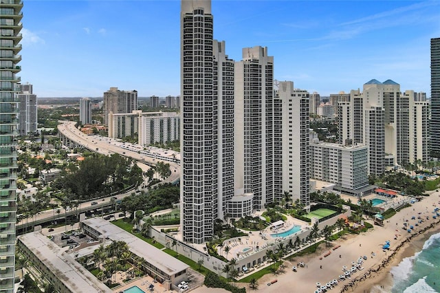 property's view of city featuring a view of the beach and a water view