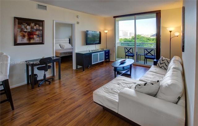 living room with dark hardwood / wood-style flooring