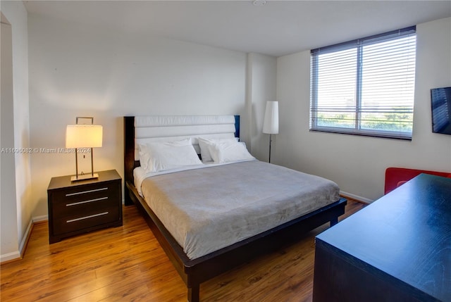 bedroom featuring hardwood / wood-style floors