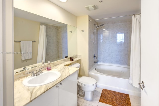 full bathroom featuring tile patterned flooring, vanity, shower / bath combo, and toilet