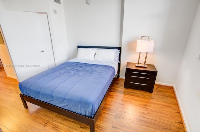 bedroom with light hardwood / wood-style floors