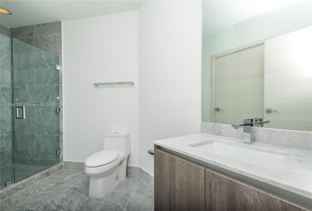 bathroom featuring vanity, an enclosed shower, and toilet