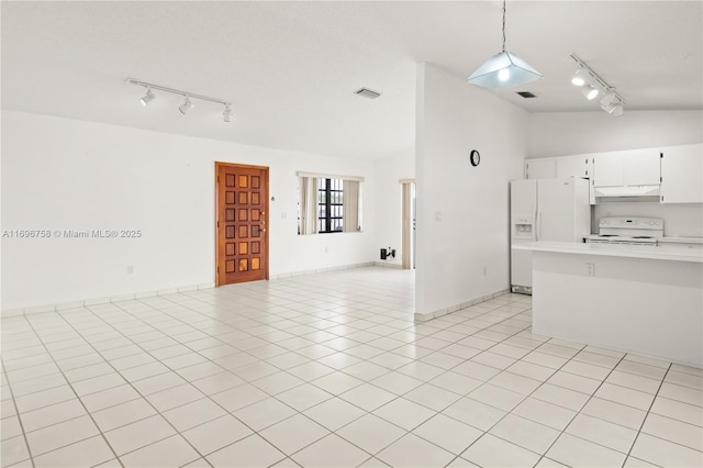 kitchen featuring white cabinetry, white appliances, light tile patterned flooring, hanging light fixtures, and vaulted ceiling