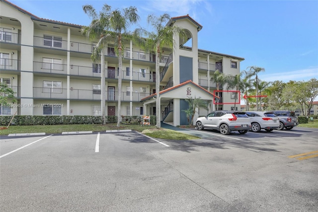 12900 SW 13th St Unit 214E, Pembroke Pines, FL 33027 - view of apartment building / complex featuring uncovered parking