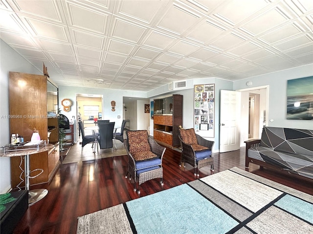 12900 SW 13th St Unit 214E, Pembroke Pines, FL 33027 - living room featuring an office area, wood finished floors, and an ornate ceiling