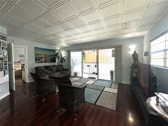 12900 SW 13th St Unit 214E, Pembroke Pines, FL 33027 - living area featuring wood finished floors, healthy amount of natural light, and an ornate ceiling
