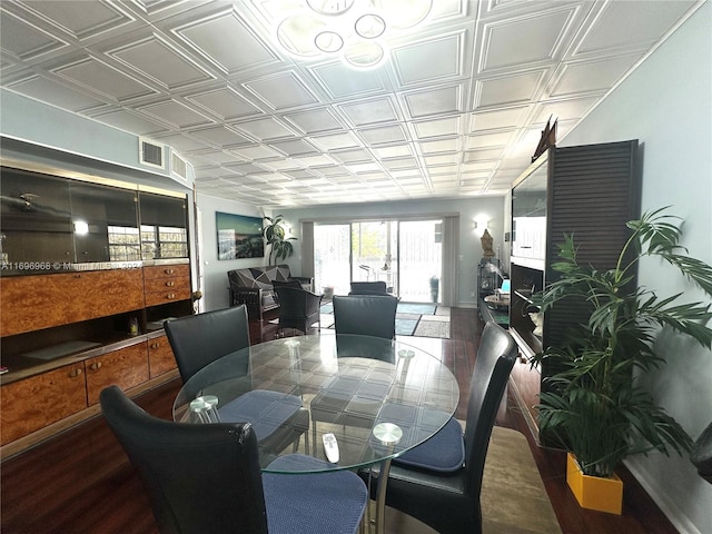 dining room with dark hardwood / wood-style flooring