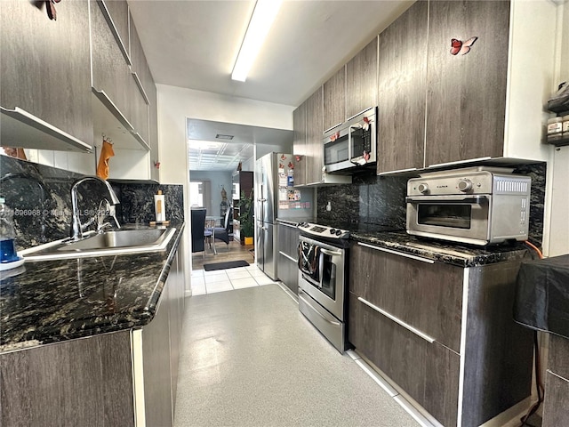 12900 SW 13th St Unit 214E, Pembroke Pines, FL 33027 - kitchen with stainless steel appliances, backsplash, and modern cabinets