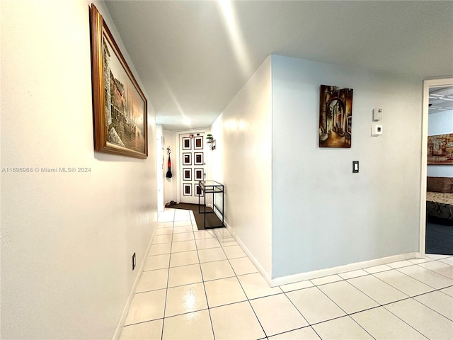 corridor with light tile patterned flooring