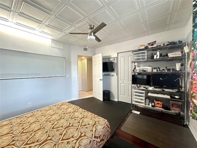 12900 SW 13th St Unit 214E, Pembroke Pines, FL 33027 - bedroom featuring ceiling fan, a closet, and an ornate ceiling