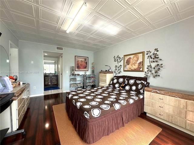 12900 SW 13th St Unit 214E, Pembroke Pines, FL 33027 - bedroom featuring an ornate ceiling and dark wood finished floors
