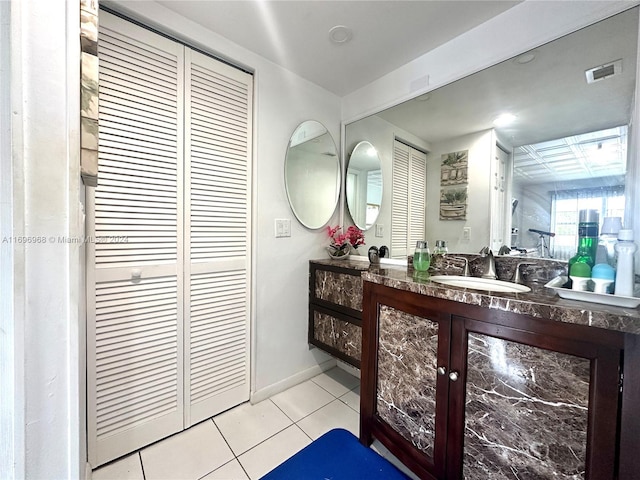 bathroom with tile patterned floors and vanity