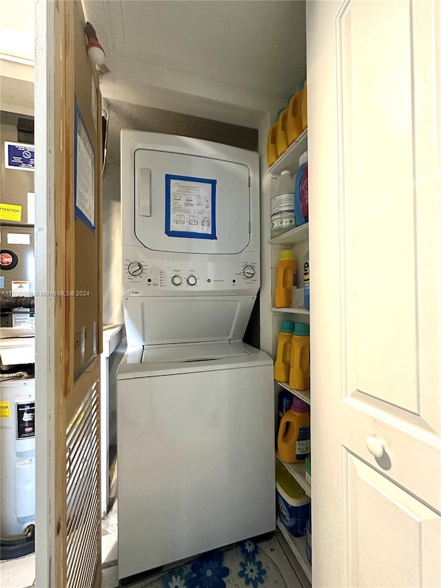 washroom featuring stacked washer and dryer