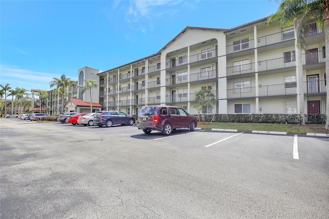 12900 SW 13th St Unit 214E, Pembroke Pines, FL 33027 - view of apartment building / complex featuring uncovered parking