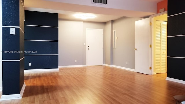 unfurnished room featuring hardwood / wood-style floors