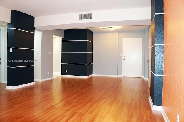 unfurnished living room with light hardwood / wood-style flooring