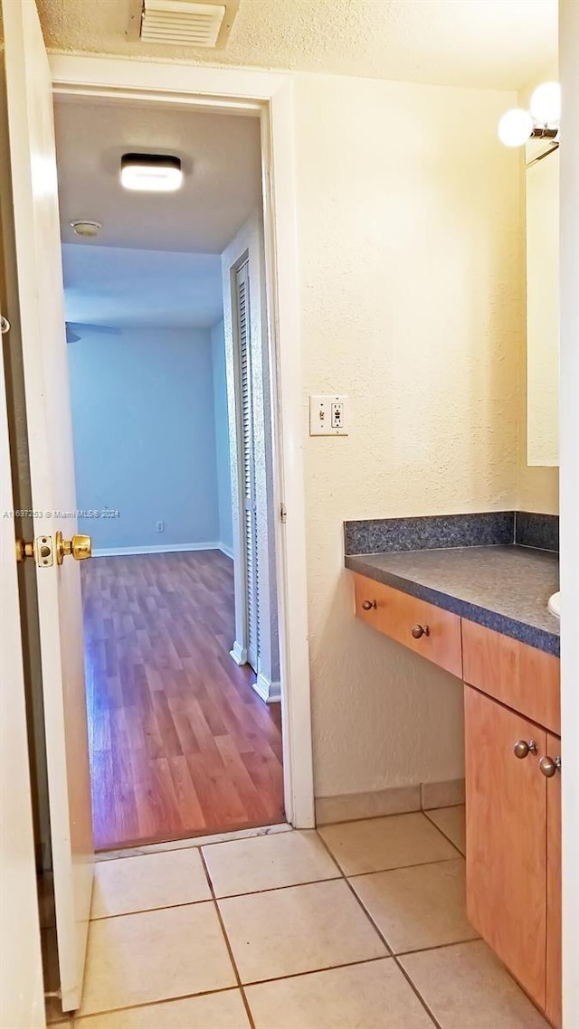 bathroom with vanity and hardwood / wood-style flooring