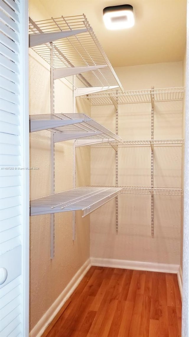 1900 Diana Dr Unit 3E, Hallandale Beach, FL 33009 - walk in closet featuring wood finished floors