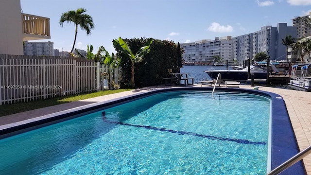 view of pool featuring a water view