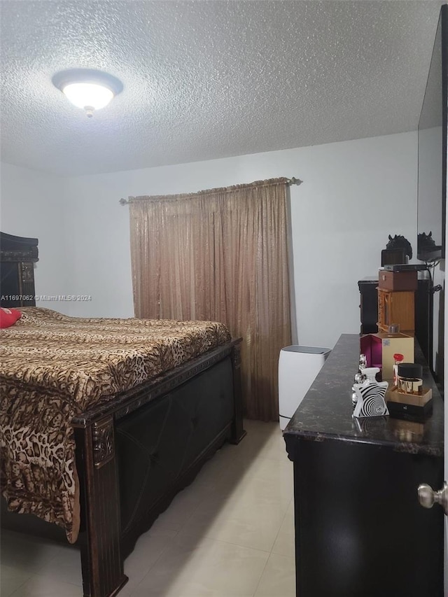 bedroom featuring a textured ceiling