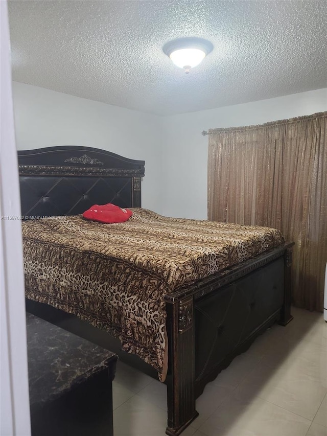 bedroom featuring a textured ceiling