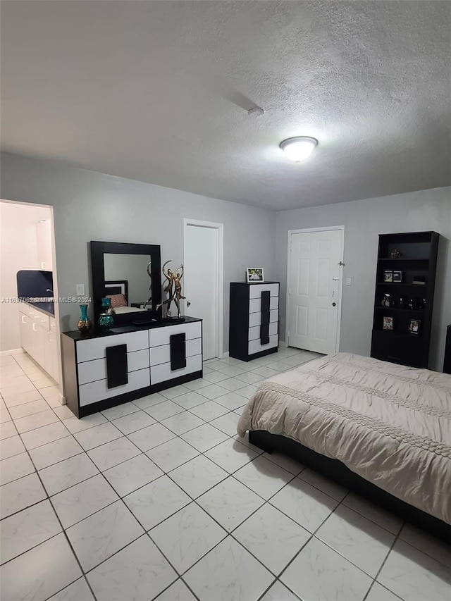 bedroom featuring a textured ceiling