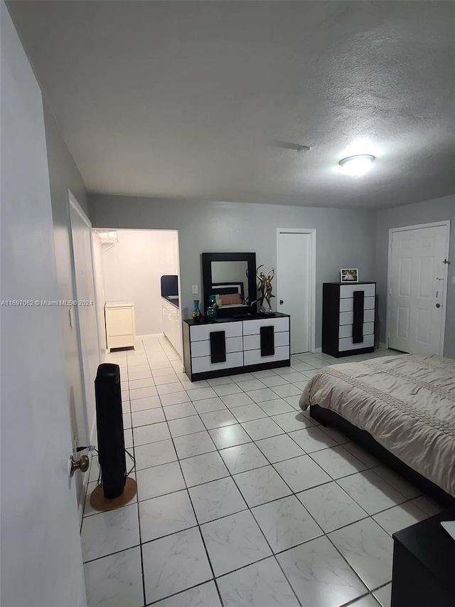 bedroom featuring a textured ceiling