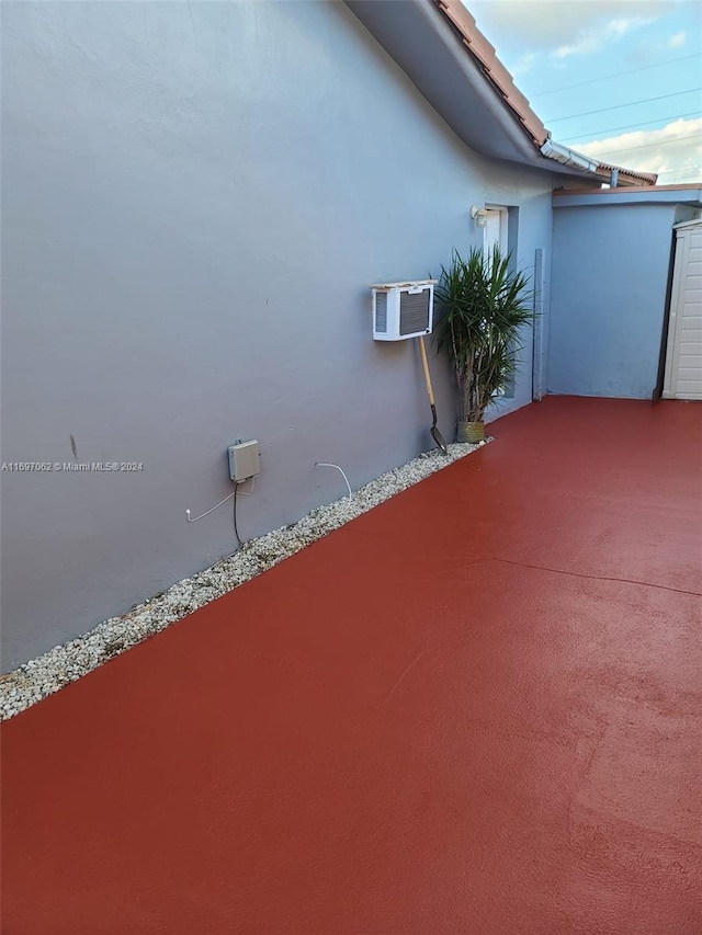 view of patio / terrace with a wall unit AC