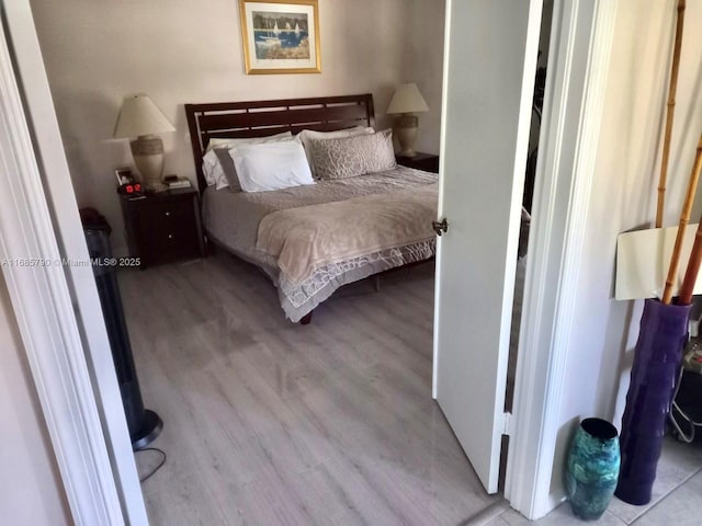 bedroom featuring light wood-style flooring