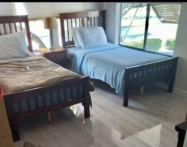 bedroom featuring wood-type flooring