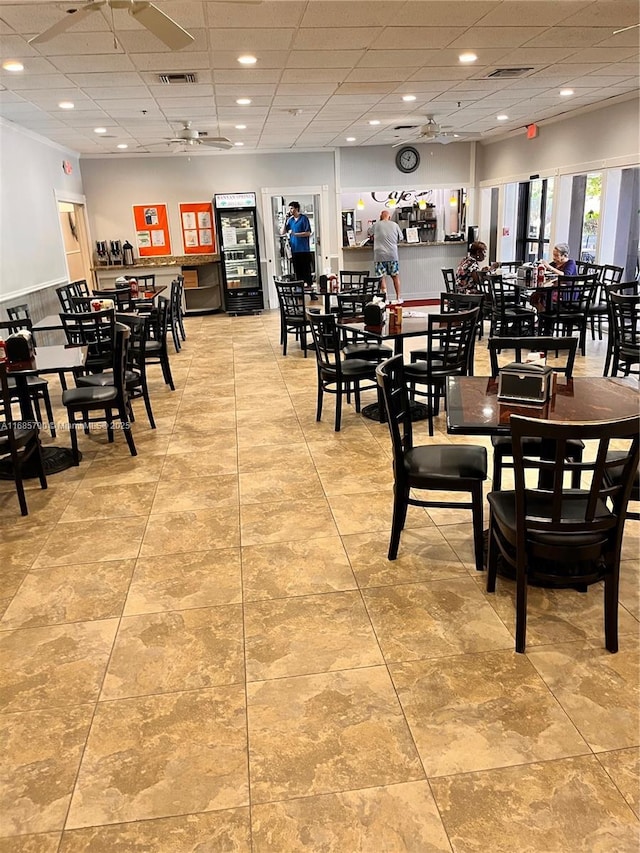 dining area featuring a drop ceiling and visible vents