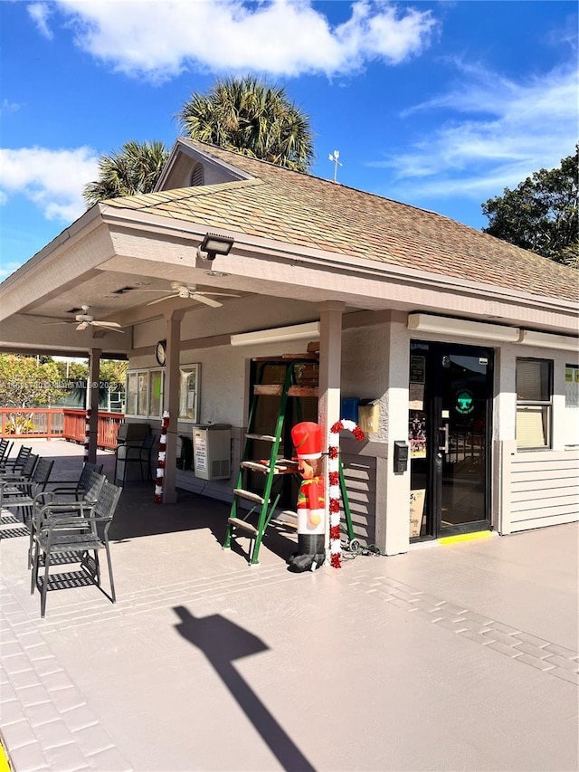 view of property's community with a patio, a bar, and fence