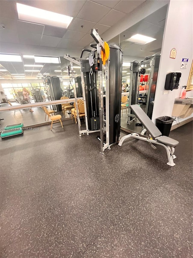 gym featuring a drop ceiling