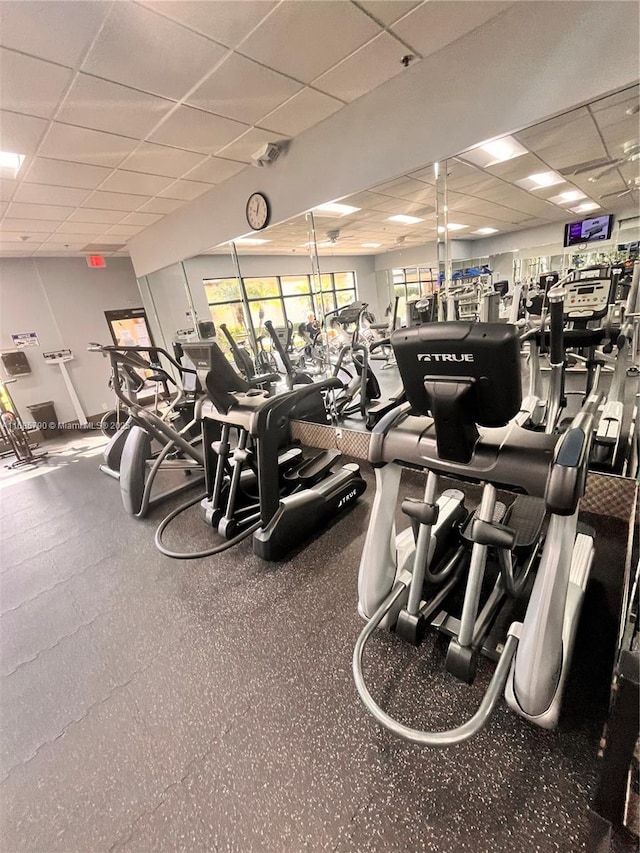 gym featuring a paneled ceiling