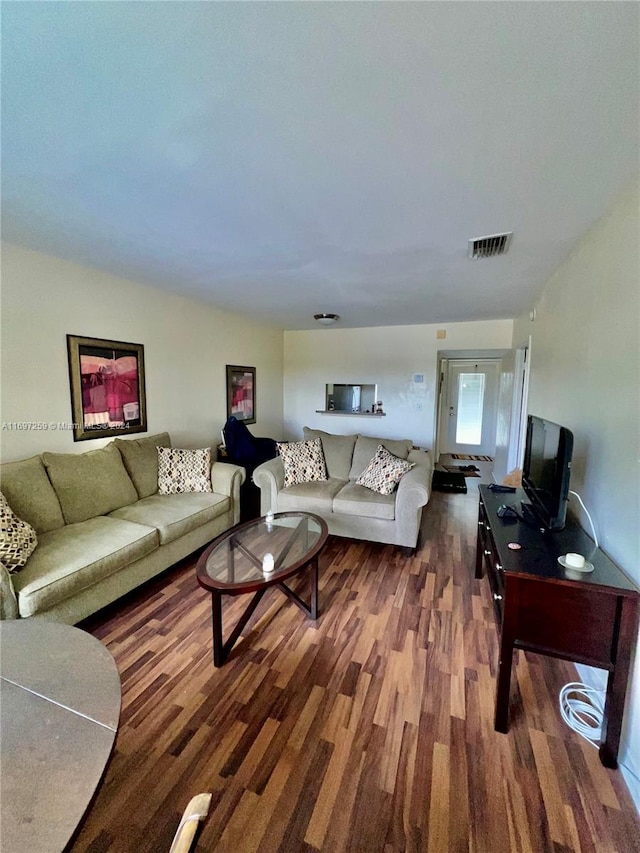 living room with dark hardwood / wood-style floors