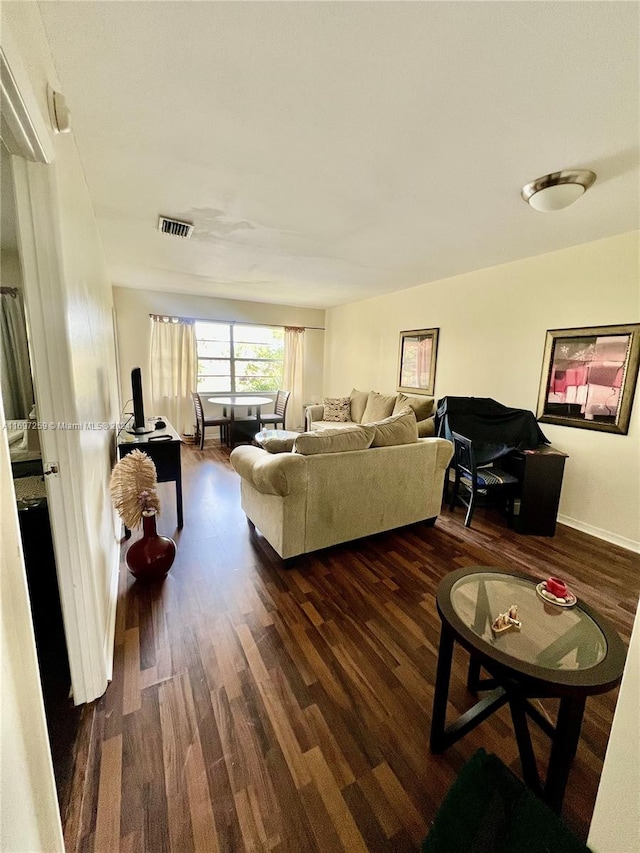 living room with dark wood-type flooring