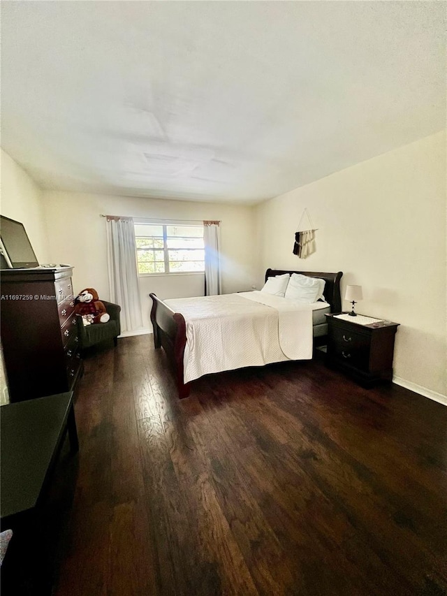 bedroom featuring dark hardwood / wood-style floors