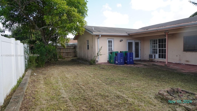 view of yard with french doors