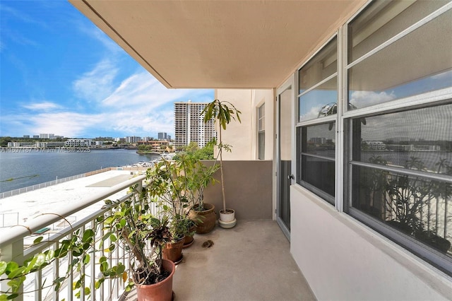 balcony featuring a water view