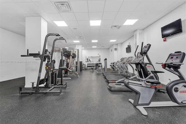 workout area featuring a paneled ceiling