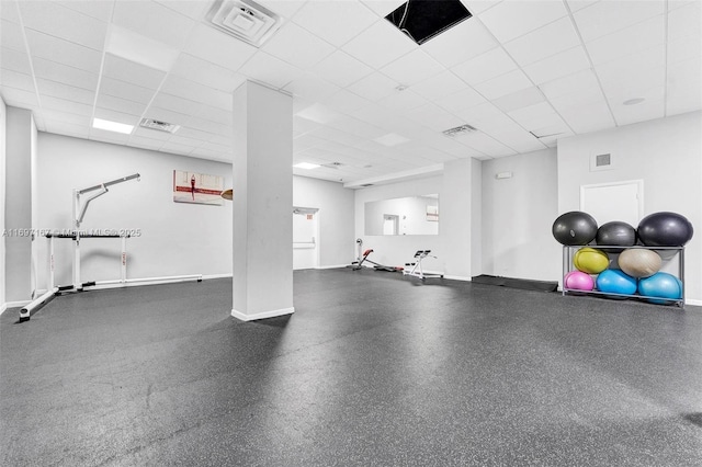 exercise area featuring a drop ceiling