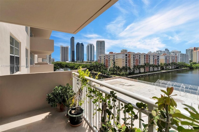 balcony featuring a water view