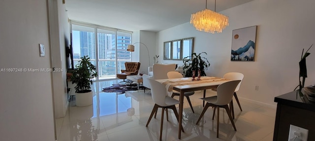 tiled dining room with a notable chandelier