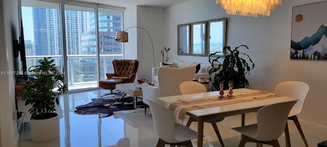 dining area with an inviting chandelier