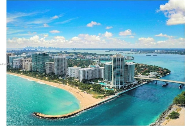 aerial view featuring a view of the beach and a water view