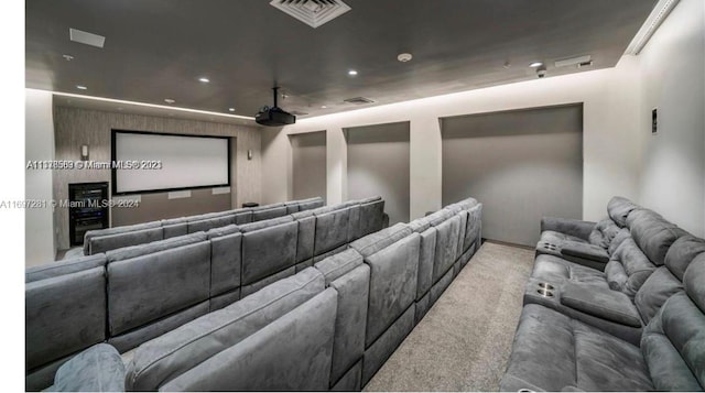 home theater featuring light colored carpet