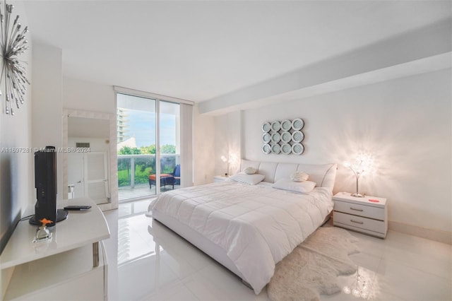 tiled bedroom with access to outside and floor to ceiling windows